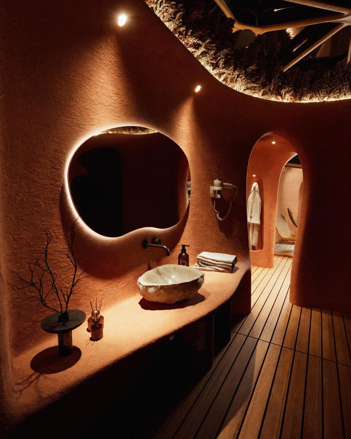 Warm clay-finished wash station inside a dome spa
