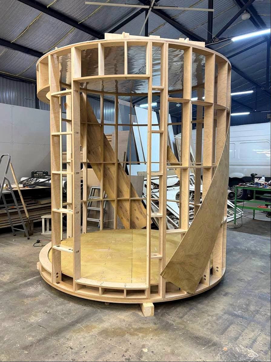 CNC-cut plywood ring-and-rib frame for a cylindrical sauna